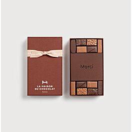 Gift Box Merci 12 Chocolates on a grey background
